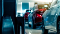 Cars displayed in a showroom, showcasing automotive excellence.