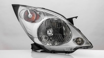 modern automotive headlight with reflection isolated on light background modern automotive headlight with reflection isolated on light background