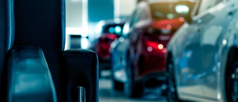 Cars displayed in a showroom, showcasing automotive excellence. Cars displayed in a showroom, showcasing automotive excellence.