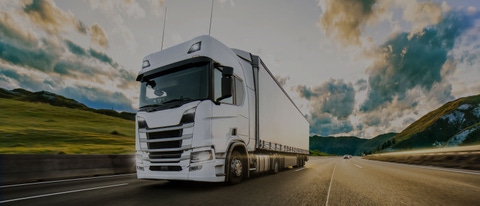 A truck drives on a road with lubricant components